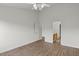 Bright bedroom with ceiling fan, hardwood flooring and adjoining bathroom at 1910 Towne Park Dr, Mcdonough, GA 30252