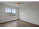 Bedroom with ceiling fan and hardwood floors benefits from ample natural light at 1910 Towne Park Dr, Mcdonough, GA 30252