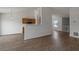 Open concept living space features hardwood floors and adjoins a cozy kitchen at 1910 Towne Park Dr, Mcdonough, GA 30252
