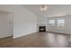 Bright and airy living room with hardwood floors, a fireplace, and ample space for entertaining guests at 1910 Towne Park Dr, Mcdonough, GA 30252