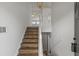 Bright entryway showcasing a staircase with wooden treads and white railing, leading to the upper level at 1910 Towne Park Dr, Mcdonough, GA 30252