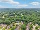 Wide aerial shot showing a community with mature trees and single Gathering homes at 4508 Meadow Vista Trce, Lithonia, GA 30038