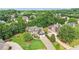Aerial view of a brick and siding home featuring a three-car garage and big driveway at 4508 Meadow Vista Trce, Lithonia, GA 30038