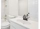 Neutrally-toned bathroom with white toilet, vanity, tub, and tiled shower at 4508 Meadow Vista Trce, Lithonia, GA 30038