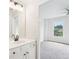 Bright bathroom featuring double vanity, framed mirror, and modern lighting at 4508 Meadow Vista Trce, Lithonia, GA 30038