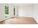 Light and airy bedroom with hardwood floors, white trim, and ample natural light at 4508 Meadow Vista Trce, Lithonia, GA 30038