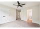 Spacious bedroom features neutral walls, carpet flooring, and a ceiling fan at 4508 Meadow Vista Trce, Lithonia, GA 30038