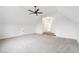 Bonus room featuring carpet floors, ceiling fan, and ample natural light at 4508 Meadow Vista Trce, Lithonia, GA 30038