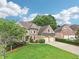 Beautiful two-story brick home featuring a two-car garage and a well-manicured lawn at 4508 Meadow Vista Trce, Lithonia, GA 30038