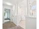 Hallway with tile floor leading to the ensuite bath with tub at 4508 Meadow Vista Trce, Lithonia, GA 30038