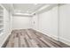 Bright living room features recessed lights, and wood-look flooring at 4508 Meadow Vista Trce, Lithonia, GA 30038