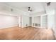 Spacious living room with ceiling fan, built-in shelving and window view at 4508 Meadow Vista Trce, Lithonia, GA 30038