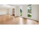 Spacious living room with hardwood floors, large windows and an open floor plan at 4508 Meadow Vista Trce, Lithonia, GA 30038