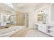 Main bathroom with a tub, shower, vanity, and ample natural light at 4508 Meadow Vista Trce, Lithonia, GA 30038