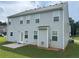 Two story home featuring light gray siding, a small patio, and a well manicured lawn at 98 Concord Pl, Hiram, GA 30141