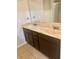 Double sink vanity with marble countertop and dark wood cabinets at 98 Concord Pl, Hiram, GA 30141