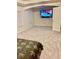 A large carpeted bedroom with a TV, a window, and a door at 98 Concord Pl, Hiram, GA 30141