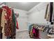 Walk-in closet with clothes hanging on racks and shelves at 98 Concord Pl, Hiram, GA 30141