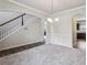 Elegant foyer and staircase lead to the home's upper levels at 98 Concord Pl, Hiram, GA 30141