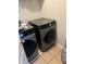 This laundry room has a gray washer and dryer at 98 Concord Pl, Hiram, GA 30141