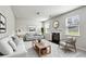 Bright living room with fireplace, neutral colors, and comfortable seating arrangement, ideal for relaxing at 98 Concord Pl, Hiram, GA 30141