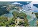 Scenic aerial view showcasing the lake community, with multiple docks and lush tree coverage at 2155 Cove Trl, Cumming, GA 30041