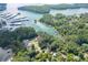 Picturesque aerial shot of the lake with homes dotting the shoreline, surrounded by dense trees at 2155 Cove Trl, Cumming, GA 30041