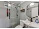 Modern bathroom featuring a glass shower with gray patterned tiles at 2155 Cove Trl, Cumming, GA 30041