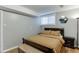 Comfortable bedroom featuring hardwood floors, neutral walls and modern furnishings at 2155 Cove Trl, Cumming, GA 30041