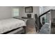 Bedroom with hardwood floors, light gray walls, a queen bed, and plenty of room for a gaming setup at 2155 Cove Trl, Cumming, GA 30041