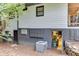 Exterior view of the lower level basement entrance, air conditioning unit, and access to storage at 2155 Cove Trl, Cumming, GA 30041