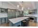 Modern kitchen featuring an island, stainless steel appliances, and custom cabinets for a stylish and functional space at 2155 Cove Trl, Cumming, GA 30041