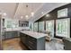 Well-designed kitchen with stainless appliances, island seating, and generous natural light highlighting modern finishes at 2155 Cove Trl, Cumming, GA 30041