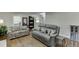 Cozy living room with two sofas, hardwood floors, and a well-lit ambiance creating a welcoming space at 2155 Cove Trl, Cumming, GA 30041