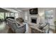 The living room features hardwood floors, a fireplace, and an open layout with views of the dining area at 2155 Cove Trl, Cumming, GA 30041