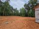 Vacant lot with trees around the building site. Ready for a new home construction at 354 Spruill Bridge Rd, Temple, GA 30179