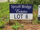 Sign for Spruill Bridge Estates, Lot 6, indicating available land for building a custom home in a desirable community at 354 Spruill Bridge Rd, Temple, GA 30179