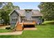 Enjoy outdoor living with a spacious wooden deck and landscaped backyard, perfect for entertaining or relaxing at 4150 Sterling Pointe Dr, Douglasville, GA 30135