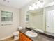 Bathroom featuring a single sink vanity, large mirror, and shower at 4150 Sterling Pointe Dr, Douglasville, GA 30135