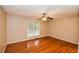 Bedroom with hardwood floors, ceiling fan, and a bright window at 4150 Sterling Pointe Dr, Douglasville, GA 30135