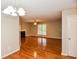 Inviting living room with hardwood floors, fireplace, fan, and large window for natural light at 4150 Sterling Pointe Dr, Douglasville, GA 30135
