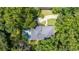 An aerial view of the property showing the roof, pool, driveway, and surrounding trees at 837 Pine Ridge Dr, Lawrenceville, GA 30043