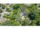 Aerial view of a beautiful home surrounded by lush greenery and mature trees, property lines highlighted at 837 Pine Ridge Dr, Lawrenceville, GA 30043