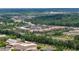 Wide aerial perspective highlights the community's proximity to Coolray Field and modern apartment complexes at 837 Pine Ridge Dr, Lawrenceville, GA 30043