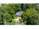 An aerial view of a property with a long driveway and lush landscaping at 837 Pine Ridge Dr, Lawrenceville, GA 30043