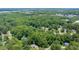 Scenic aerial shot shows a neighborhood surrounded by dense trees at 837 Pine Ridge Dr, Lawrenceville, GA 30043