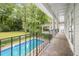 Spacious covered balcony overlooks the backyard and sparkling swimming pool at 837 Pine Ridge Dr, Lawrenceville, GA 30043
