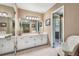Well-lit bathroom with double mirrors, vanity, cabinets and a combined shower-tub at 837 Pine Ridge Dr, Lawrenceville, GA 30043