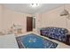 Bright bedroom with a blue patterned rug and a vanity area at 837 Pine Ridge Dr, Lawrenceville, GA 30043