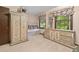 Bright bedroom featuring built-in seating, large matching dresser and wardrobe with an abundance of natural light at 837 Pine Ridge Dr, Lawrenceville, GA 30043